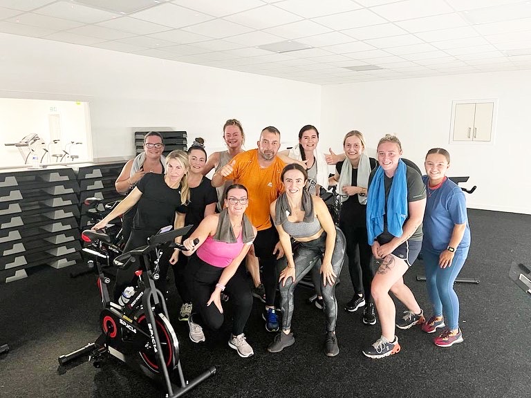 Members of Body & Soul Gym after a spin class in the studio